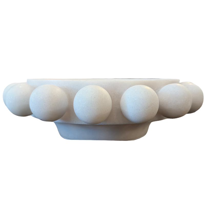 A white marble decorative bowl with a raised beaded border, shown from a side profile view against a plain white background.