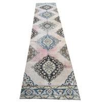 One-of-a-kind vintage wool runner rug with faded blush pink, dusty blue, cream and charcoal medallion pattern, approximately 2'11" x 12'3".