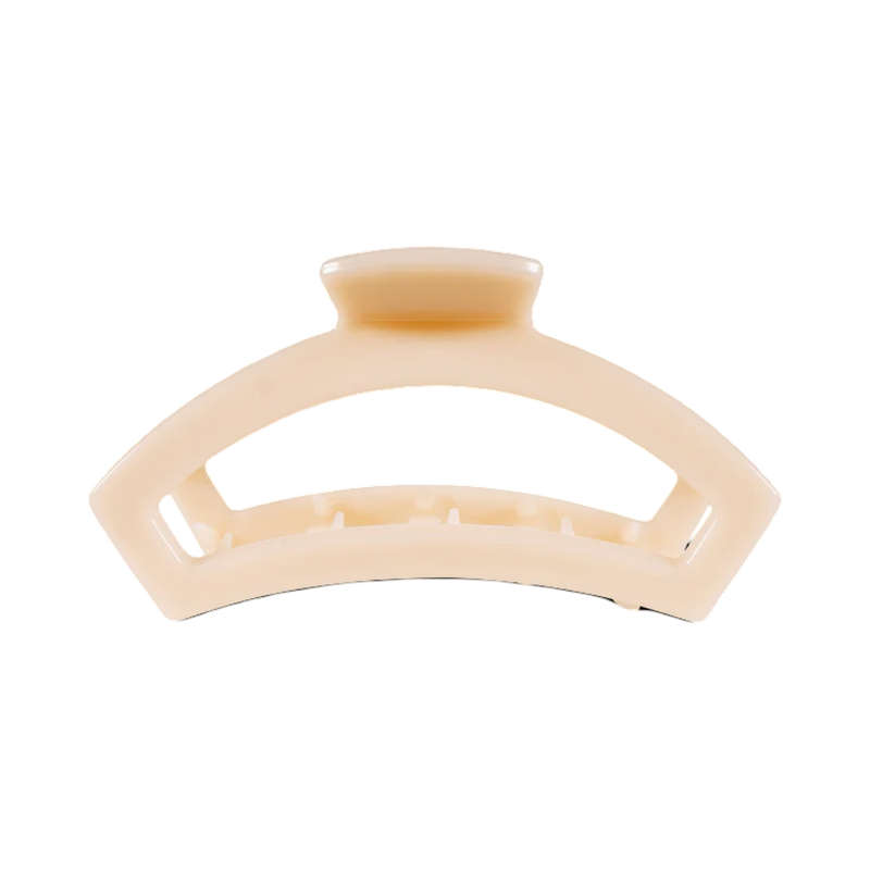 Beige hair clip on a white background