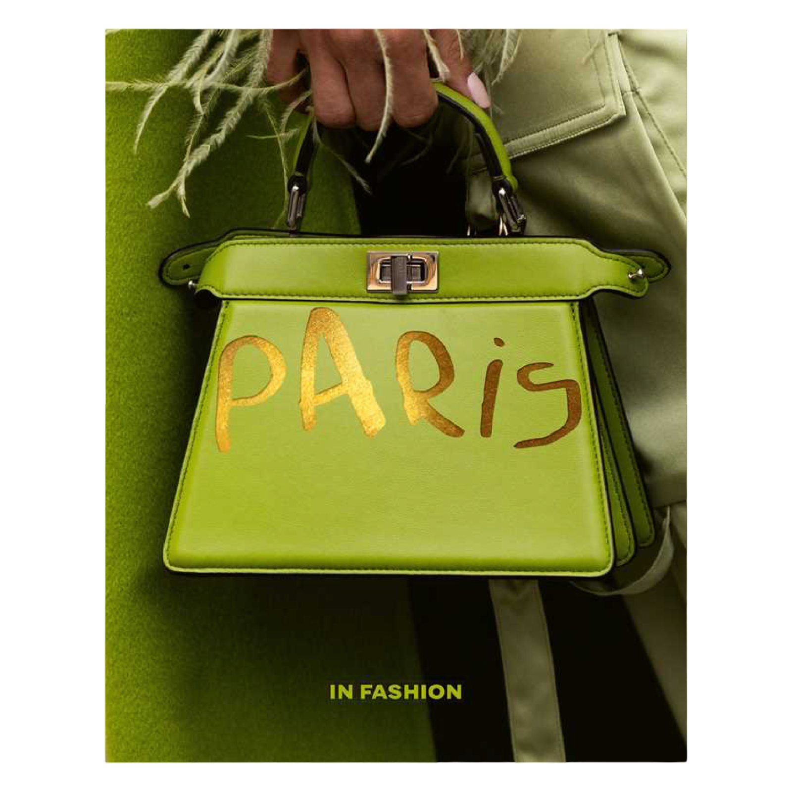 Green handbag with 'Paris' written on it, held by a person wearing a green coat.