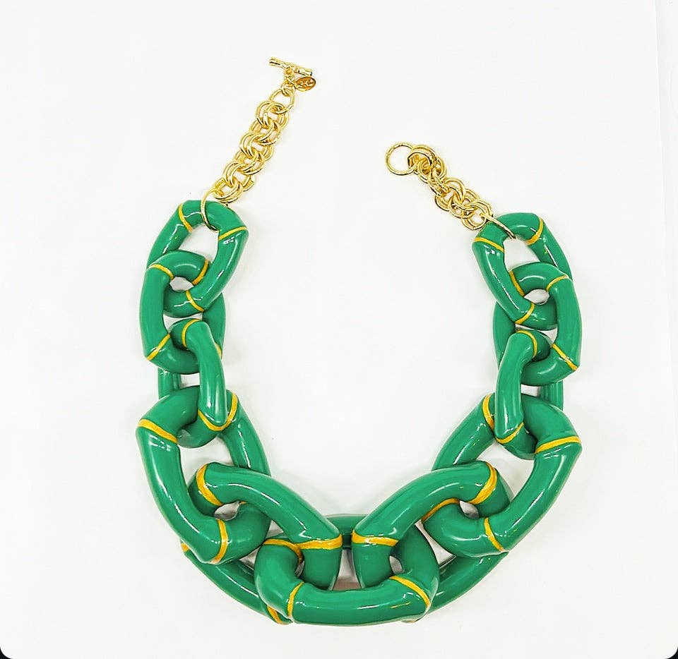 Green chain necklace with gold accents on a white background
