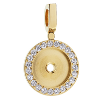 Gold pendant with clear stones on a white background