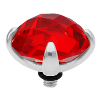 Red gemstone with silver prongs on a white background
