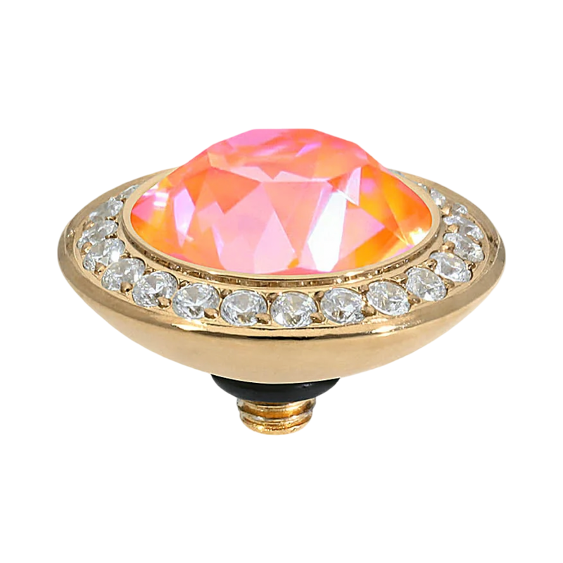 Decorative object with a pink gemstone and gold border on a white background