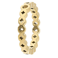 Gold ring with star and diamond pattern on a white background