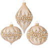 Three decorative Christmas ornaments with gold and pearl patterns on a white background