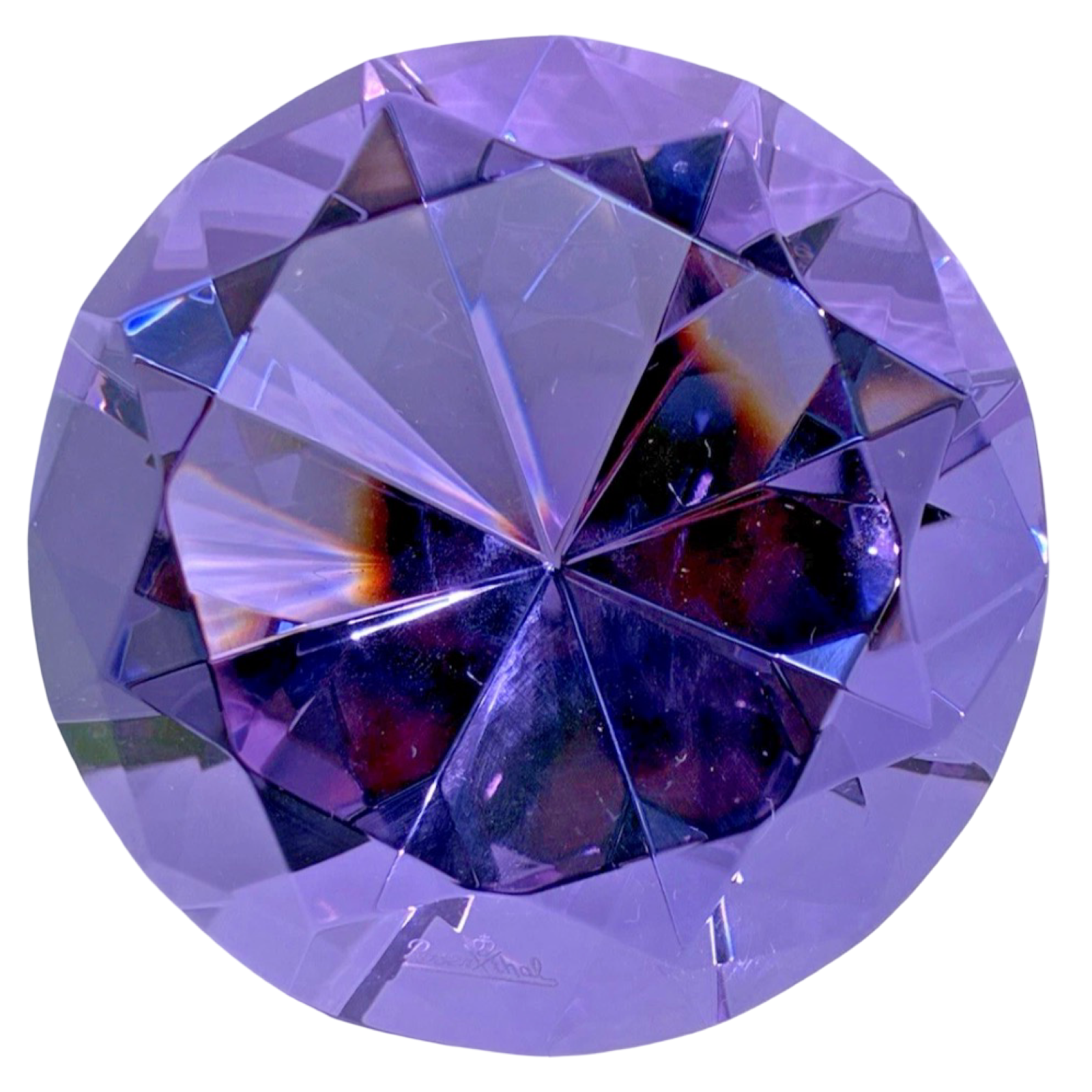 Purple gemstone with clear facets on a white background