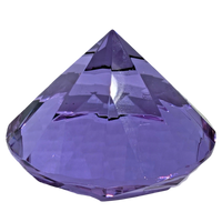 Faceted purple crystal on a white background