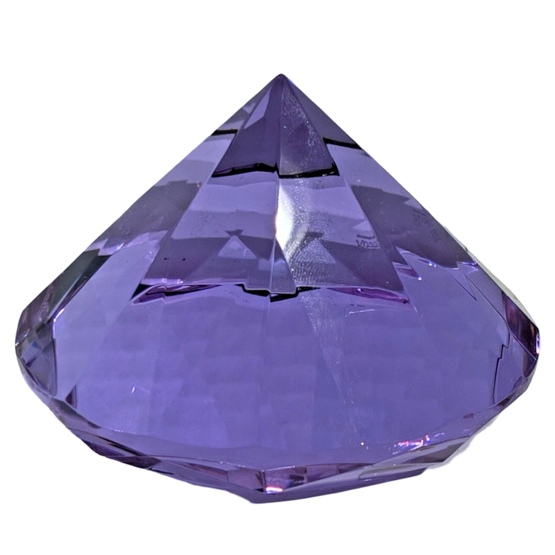Faceted purple crystal on a white background