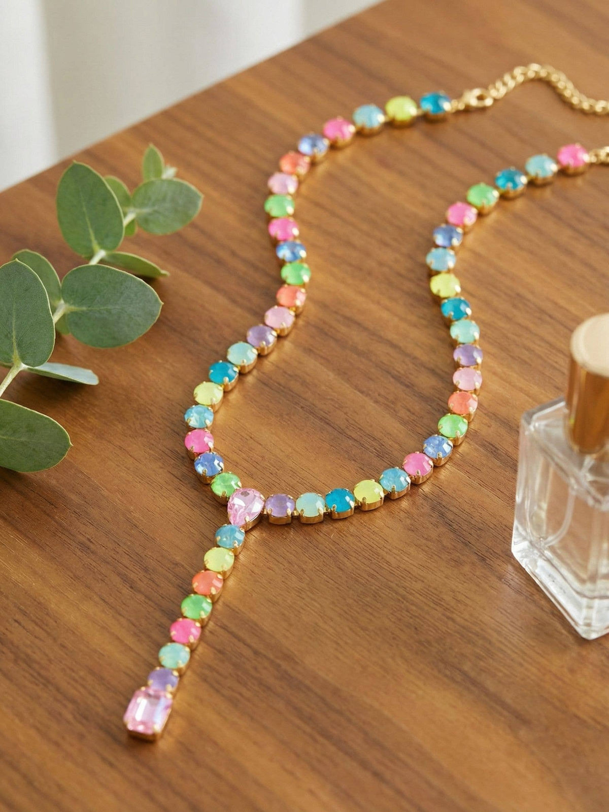 Sorrelli Candy Carnival crystal lariat Y-necklace with yellow, mint, blue, and pink stones in a bright gold-tone finish