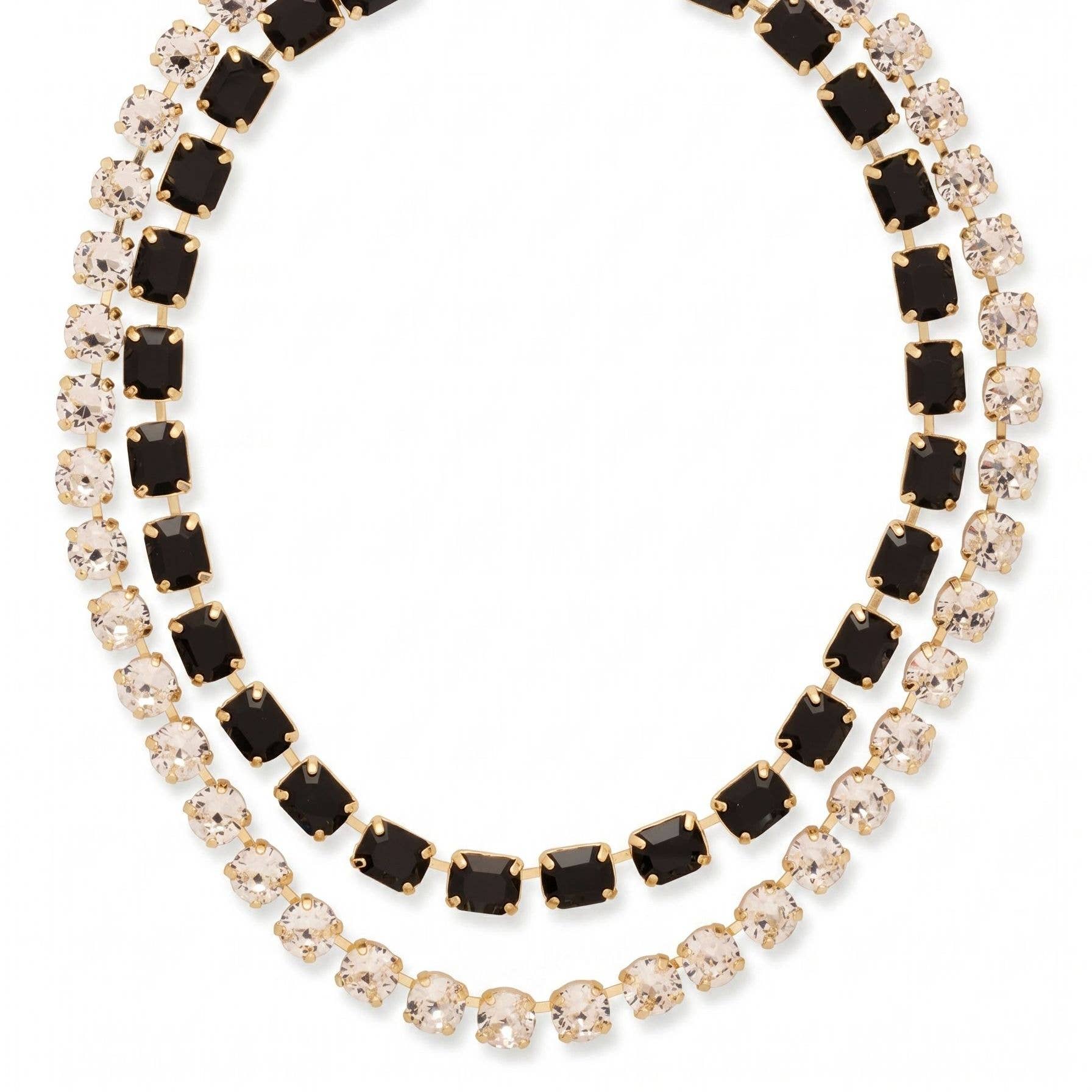A gold-toned tennis necklace featuring two rows of stones: one row with square black gemstones and the other with round clear gemstones, set against a plain white background.