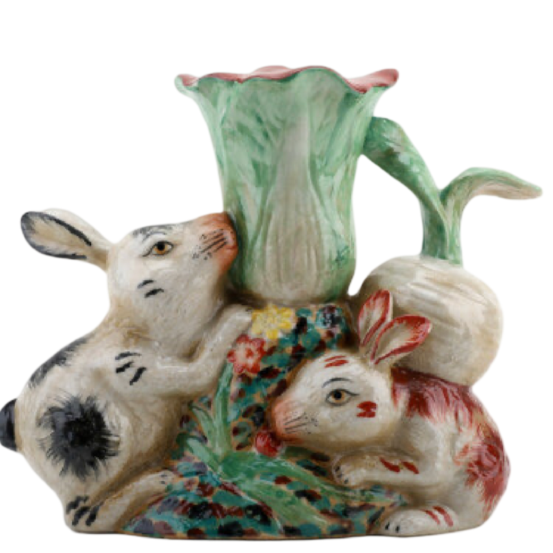 Ceramic vase with rabbit design on a white background