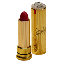A luxury lipstick shown open next to its cap, both in a polished gold finish. The lipstick bullet is a deep red, and the cap features a rhinestone-embellished top and the brand name 'Starlight' in cursive script.