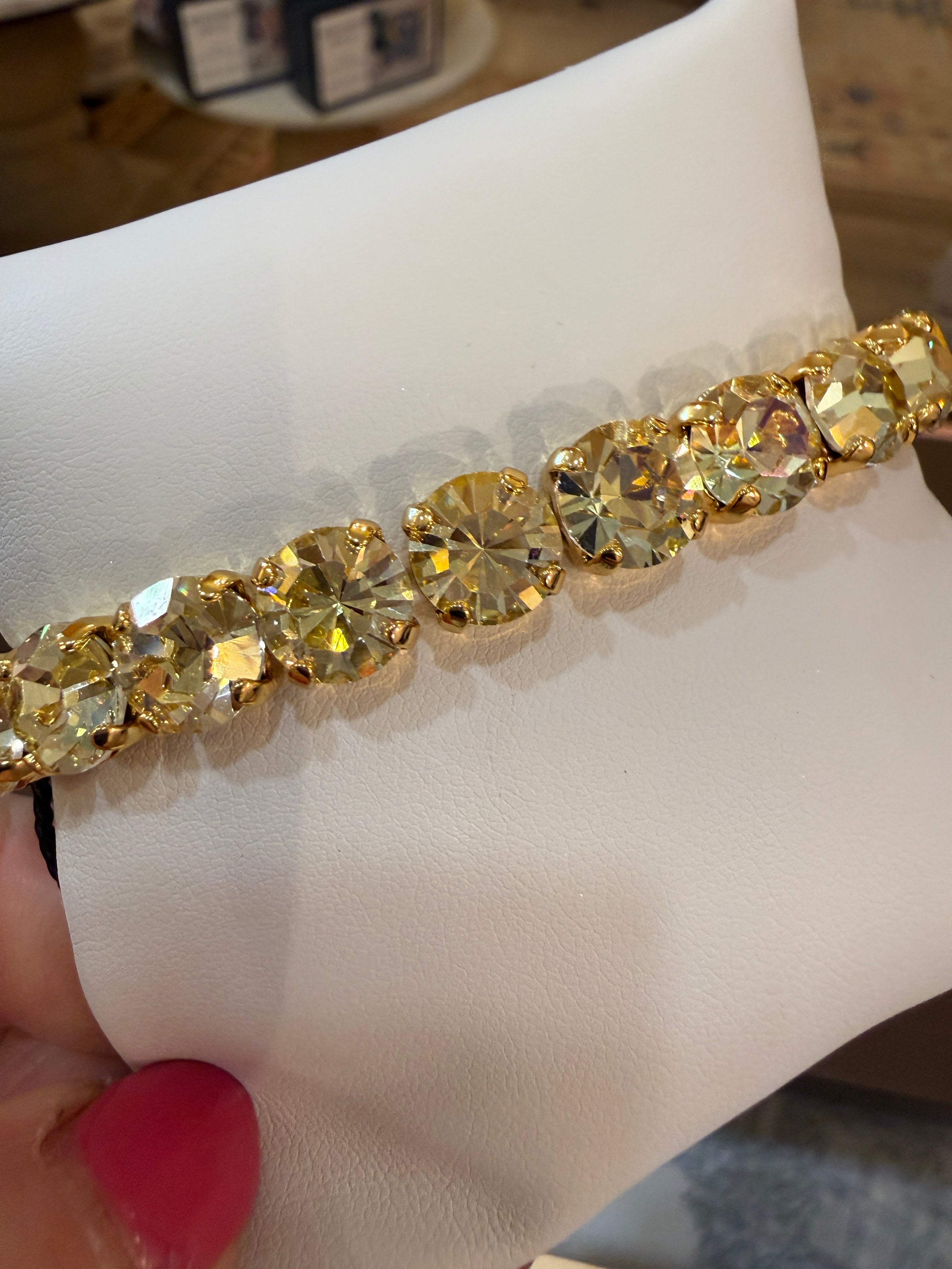 TOVA Oakland Stretch Bracelet in Solid Lemon Medium featuring vibrant yellow crystals set in antique gold-plated brass.