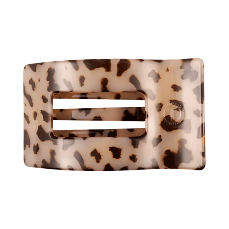 Leopard print belt buckle on a white background