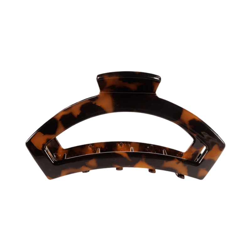 Tortoiseshell patterned hair clip on a white background