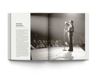Open book showing a black and white photograph of Frank Sinatra on stage with text on the left page.
