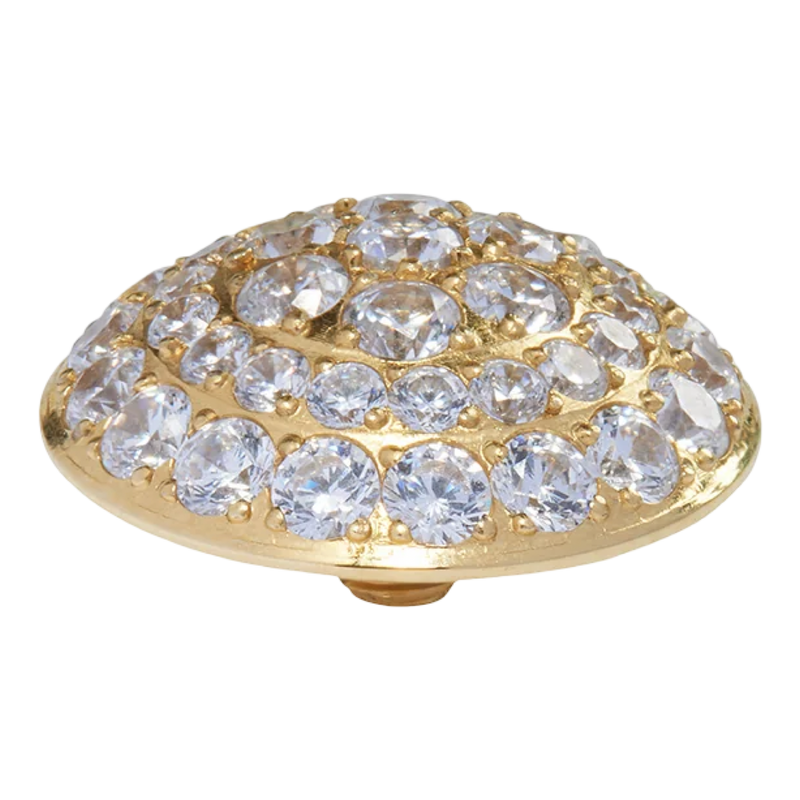 The QUDO Porto Cervo Top 13 mm in Gold brings timeless simplicity and warm sophistication to the Neutral Collection. Designed in polished gold-toned stainless steel, this interchangeable topper features a smooth rounded silhouette that layers beautifully with both statement and minimalist ring stacks.
Its clean, versatile design pairs effortlessly with the Neutral Collection’s palette of pearl, silk, crystal, champagne, black diamond, and soft metallic tones. Whether styled alone for an understated everyday