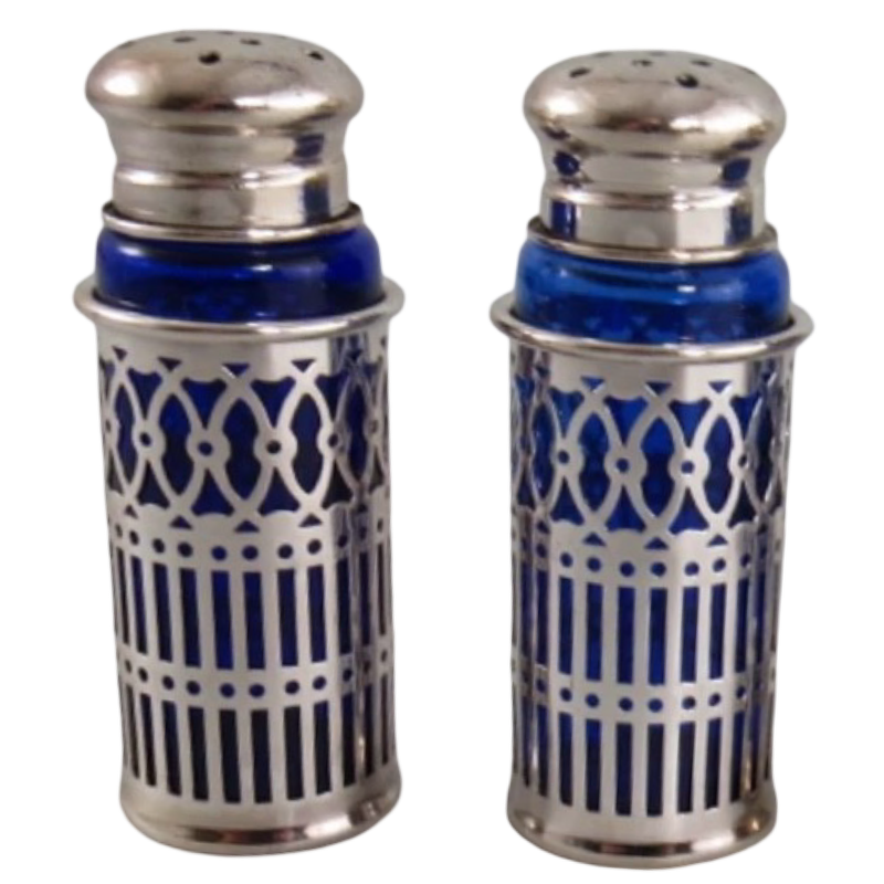 Vintage Japanese cobalt blue glass salt and pepper shakers with ornate silverplate filigree sleeves, sold as a coordinating set of two.