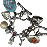 Vintage Juicy Couture silver-tone chunky charm bracelet with strawberry locket, horseshoe, pearl, heart, crystal and turquoise charms