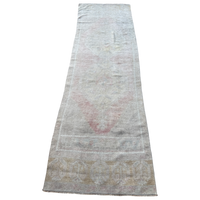 Vintage Turkish runner rug measuring approximately 2'9½" x 8'10" with a softly faded traditional pattern in blush pink, sage, blue-gray, ivory and sand tones.