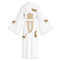 A white cotton kimono robe with wide sleeves and fringed edges, featuring embroidered leopard designs in brown and gold on the back.