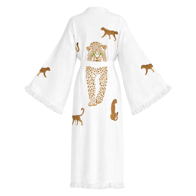 A white cotton kimono robe with wide sleeves and fringed edges, featuring embroidered leopard designs in brown and gold on the back.