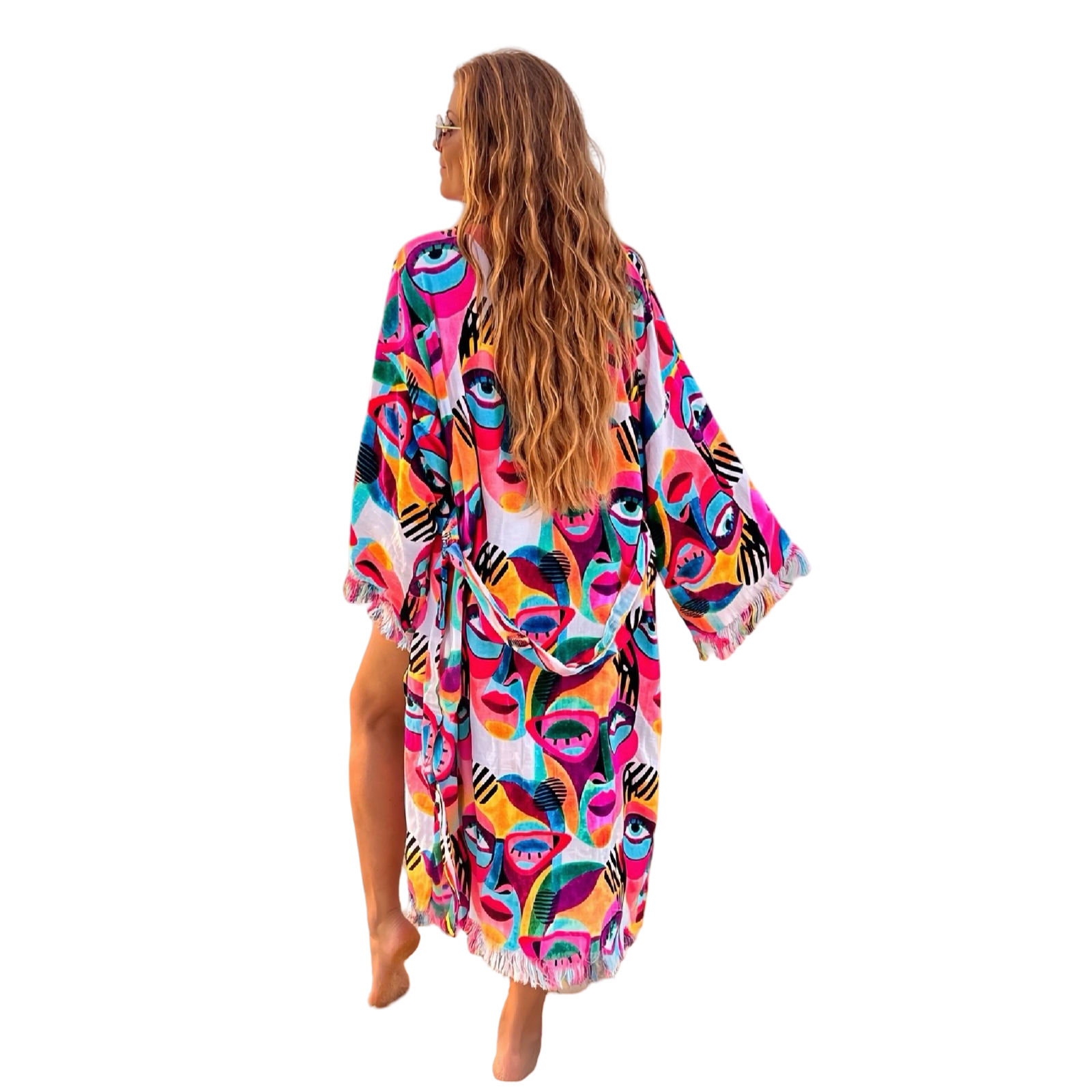 Woman wearing colorful Karli Buxton Picasso print organic cotton kaftan on the beach
