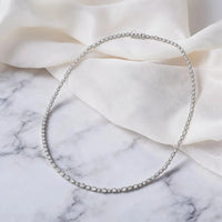 Anna Zuckerman Stella Tennis Choker necklace with elongated White Diamond Crystalline stones in platinum-finished sterling silver.