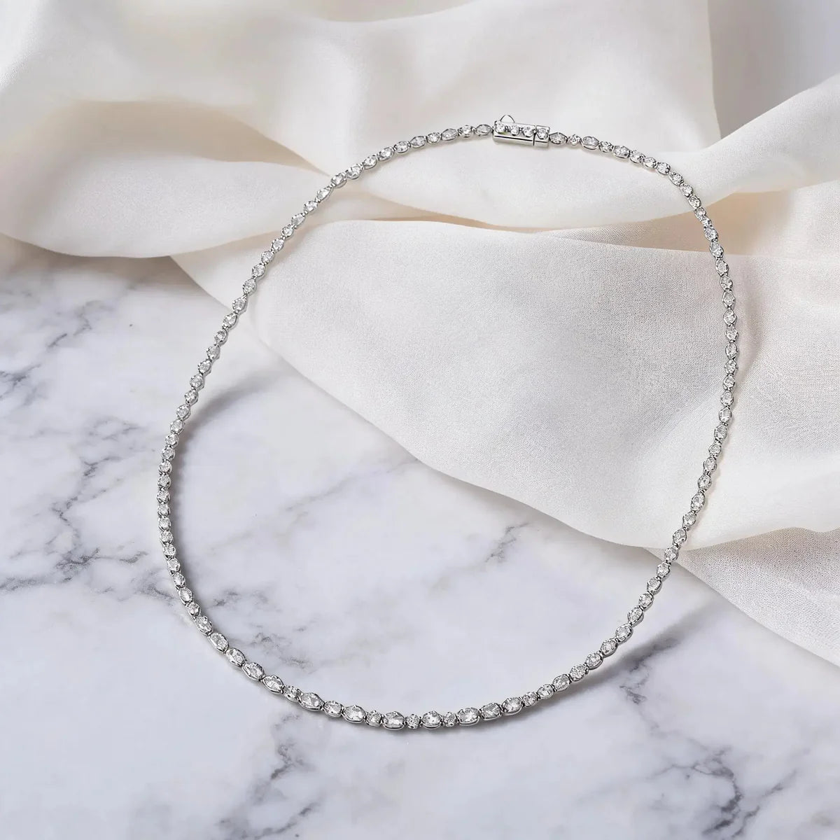 Anna Zuckerman Stella Tennis Choker necklace with elongated White Diamond Crystalline stones in platinum-finished sterling silver.