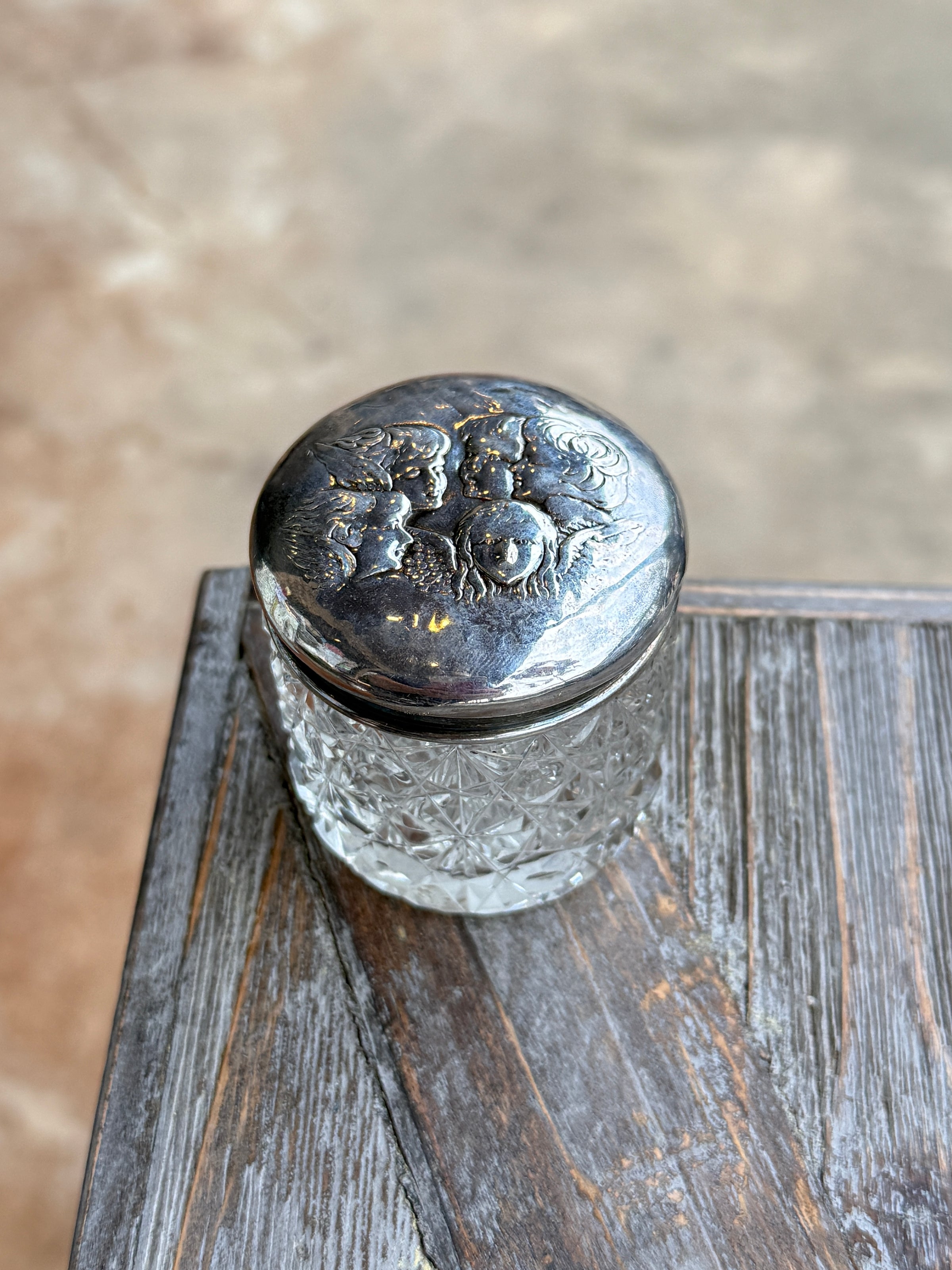 Close-up of a metal door handle on a wooden door