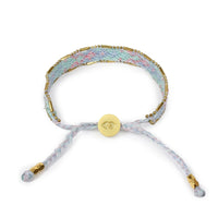 Bracelet with floral pattern and gold accents on a white background