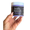 Container of bath bomb crumble purple