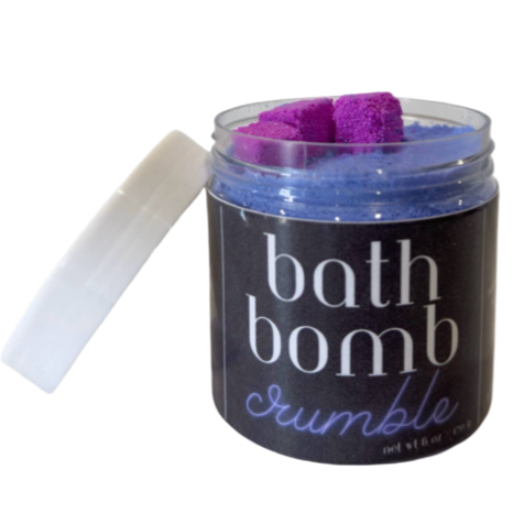 Container of bath bomb crumble purple