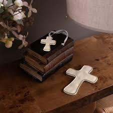 Decorative cross on a wooden surface with a soft background