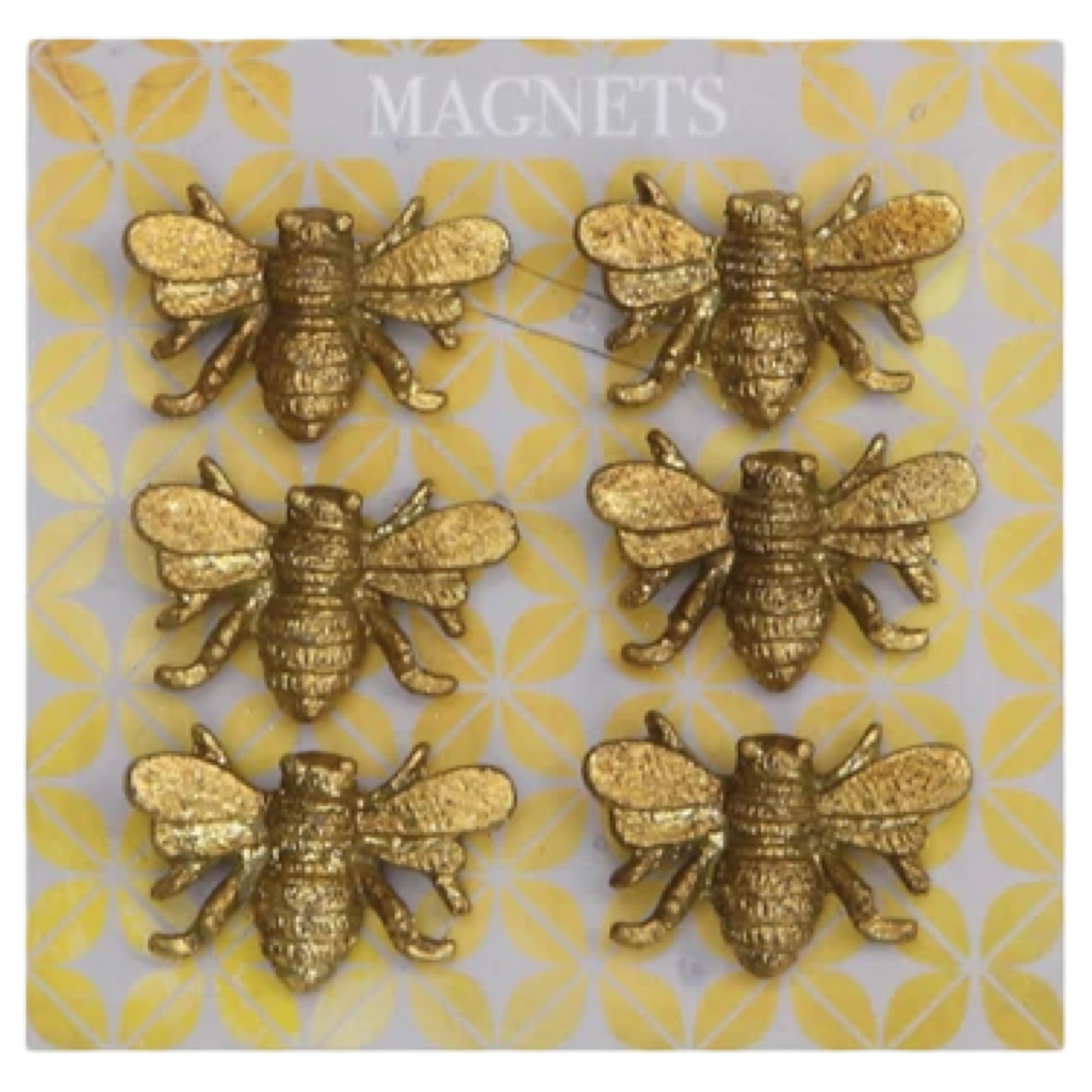Gold bee-shaped magnets on a patterned card