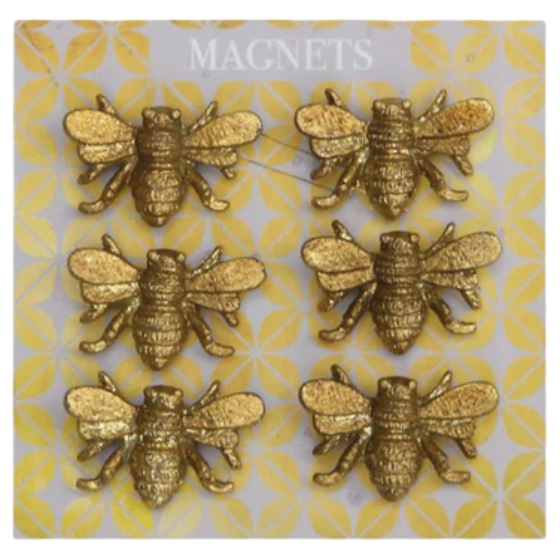 Gold bee-shaped magnets on a patterned card
