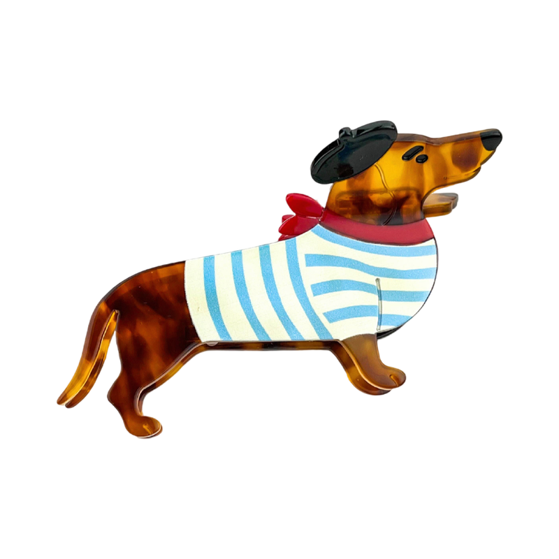 Blue acetate dachshund-shaped hair claw clip featuring a playful black beret detail.