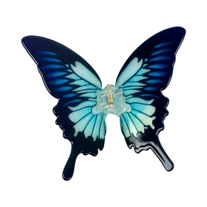 Blue acetate large butterfly-shaped hair claw clip with sculptural wings and a secure claw closure.