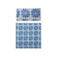 Blue floral patterned pillowcase and duvet cover set on a white background