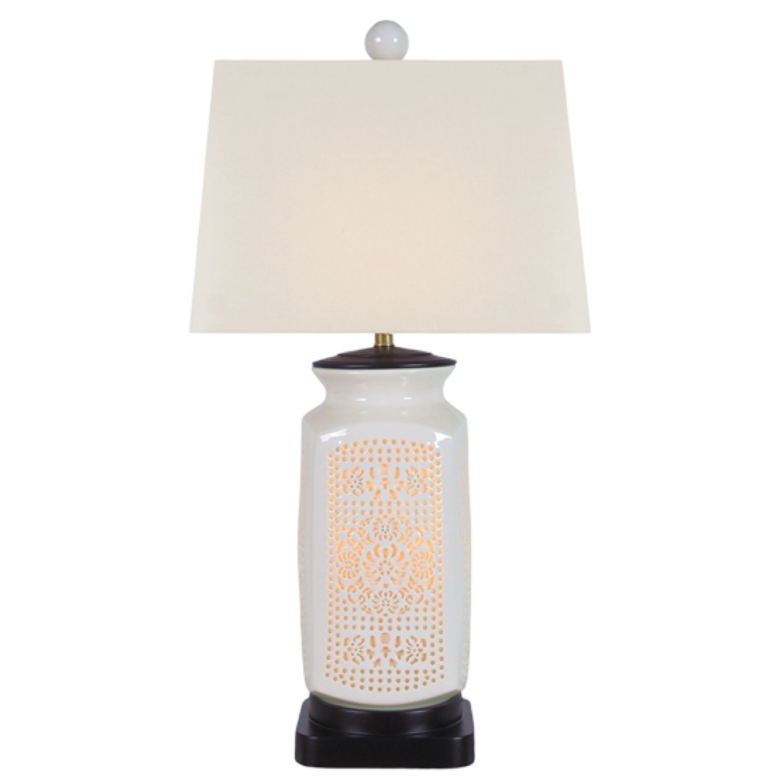 Table lamp with white textured base and cream lampshade on a white background