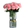 Bouquet of pink roses in a clear vase on a white background