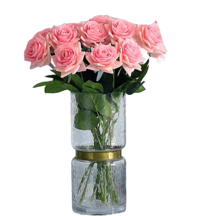 Bouquet of pink roses in a clear vase on a white background