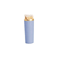 Light blue matchbox with gold cap on a white background