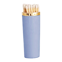Light blue matchbox with gold cap on a white background