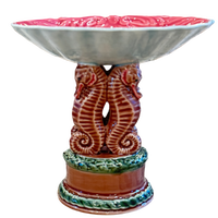 Ceramic bowl with seahorse design on a white background