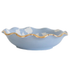 Blue ceramic bowl with a gold rim on a white background