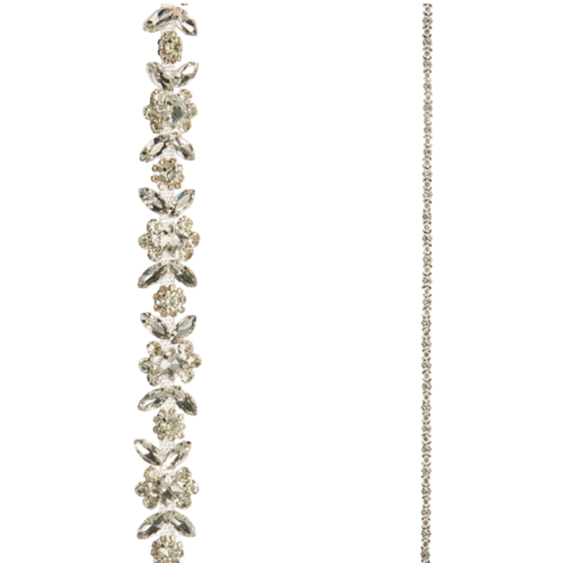 Silver bracelet with floral designs on a white background