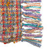 Multicolored woven fabric with tassels on a white background