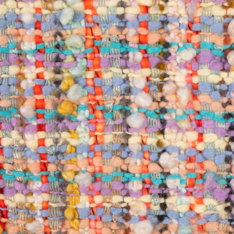 Close-up of a multicolored woven fabric with a textured pattern.